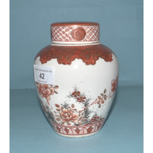 42 - A pair of Japanese Arita ginger jars with interior covers and lids decorated with blossom and birds,... 