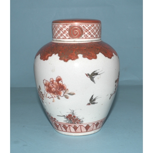 42 - A pair of Japanese Arita ginger jars with interior covers and lids decorated with blossom and birds,... 