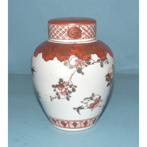 42 - A pair of Japanese Arita ginger jars with interior covers and lids decorated with blossom and birds,... 