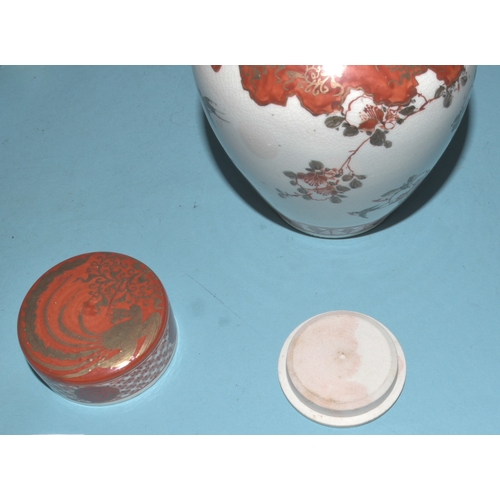 42 - A pair of Japanese Arita ginger jars with interior covers and lids decorated with blossom and birds,... 