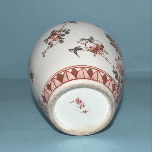42 - A pair of Japanese Arita ginger jars with interior covers and lids decorated with blossom and birds,... 