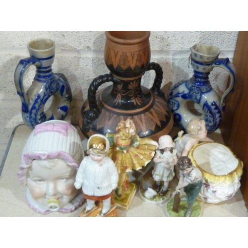 40 - A Continental porcelain tobacco jar and lid in the form of a baby's head with mouth pacifier, 14cm h... 