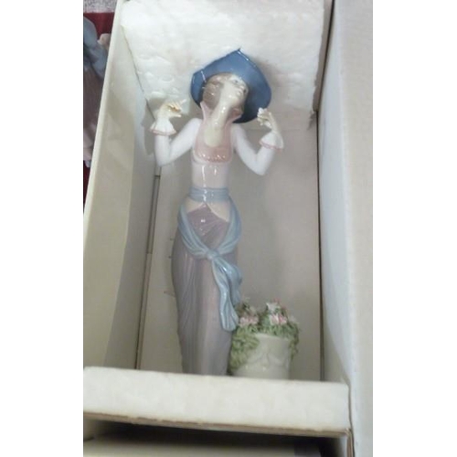 51 - A collection of Lladro figurines: 'Flowers of Paris' (boxed), 'Making a Wish' (boxed), 'Young woman ... 