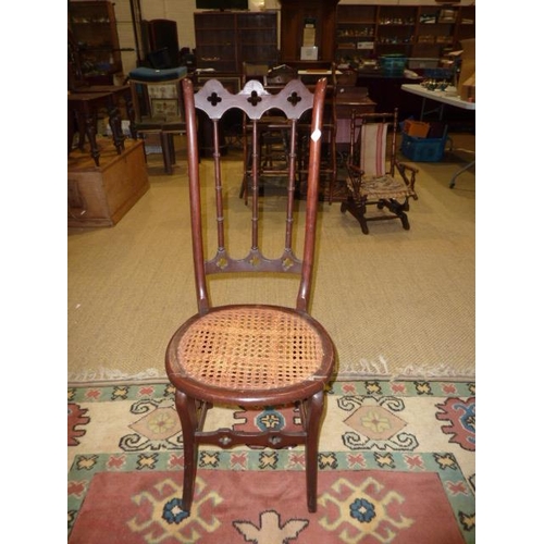 17 - A late-19th century child's American-style stained turned wood rocking chair, a cane-seated chair an... 