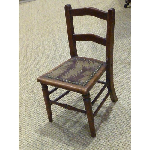 9 - A doll's metamorphic wooden high chair, a pair of doll's chairs and matching settee, (settee a/f, wo... 