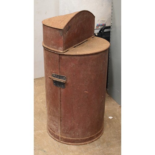 25 - An oil/paraffin drum dispenser, the hinged lid opening to reveal a brass pump and tap, with 