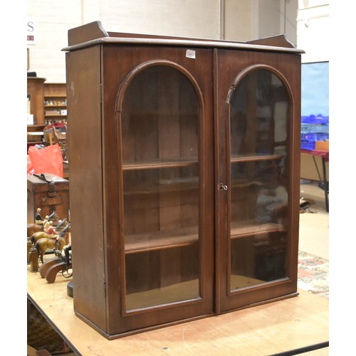 3 - An Edwardian mahogany bookcase, the rectangular top above a pair of glazed doors, 105cm wide, 135cm ... 
