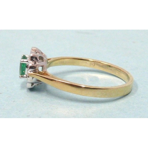 303 - An emerald and diamond cluster ring, claw-set an oval emerald within a border of ten brilliant-cut d... 