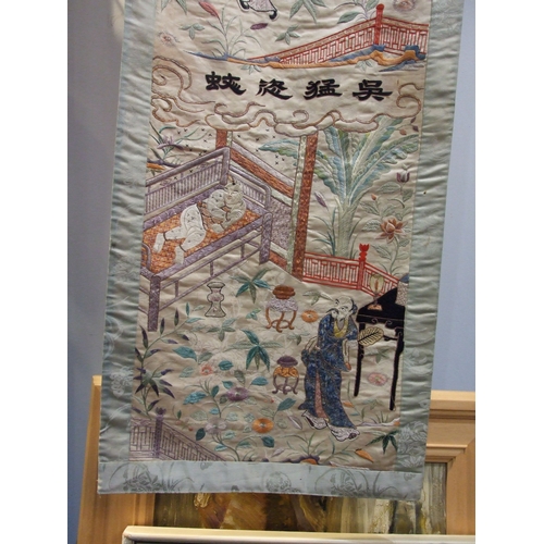 39 - An early-20th century Chinese silk-work wall hanging depicting domestic activities, 150 x 34cm, (som... 