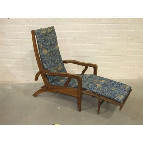 63 - Arthur Romney Green, a walnut reclining chair with adjustable back rest, shaped original open arms a... 