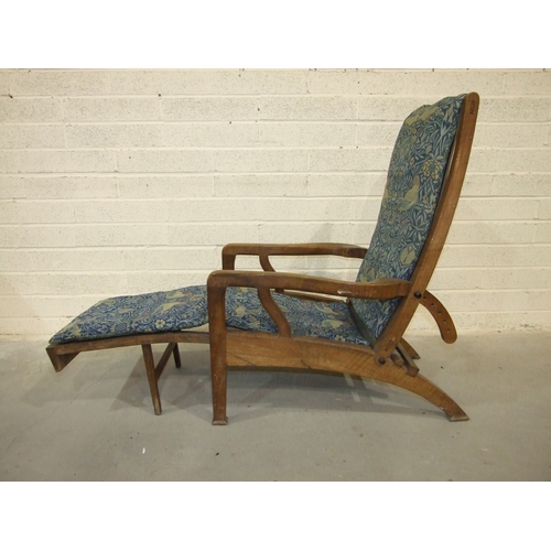 63 - Arthur Romney Green, a walnut reclining chair with adjustable back rest, shaped original open arms a... 