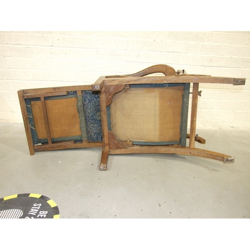 63 - Arthur Romney Green, a walnut reclining chair with adjustable back rest, shaped original open arms a... 