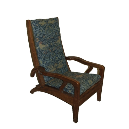 63 - Arthur Romney Green, a walnut reclining chair with adjustable back rest, shaped original open arms a... 