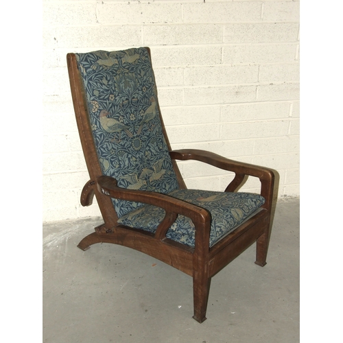 63 - Arthur Romney Green, a walnut reclining chair with adjustable back rest, shaped original open arms a... 
