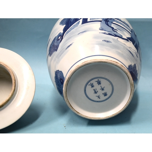 74 - A large Chinese baluster-shaped blue and white jar and lid, with six-character mark beneath.... 