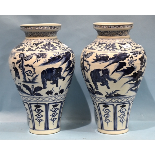 72 - A pair of Chinese large blue and white vases decorated with figures and elephants, 48cm high, (2).... 