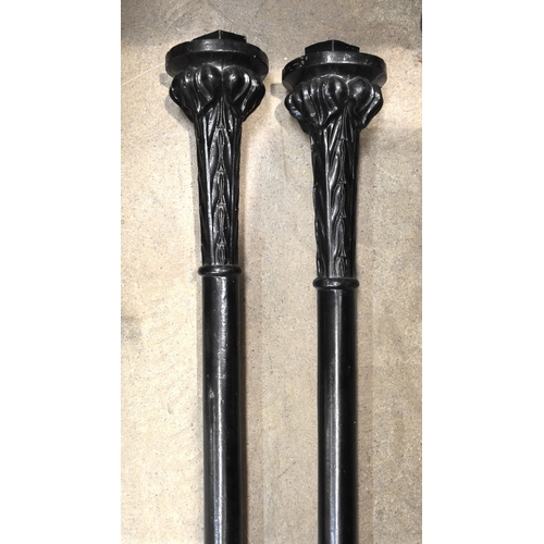 62 - A pair of cast iron corner support pillars, cast with acanthus leaves and interlaced strap-work deta... 