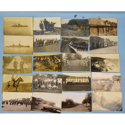 40 - A collection of thirty-three RP postcards, including army camp scenes, Beesands, Scoulton, shipping,... 