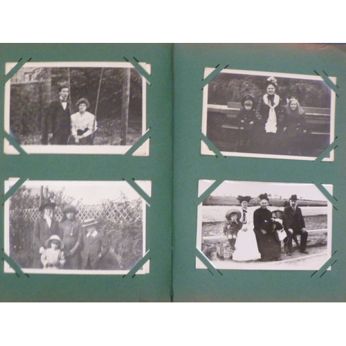 47 - An album of approximately 230 mainly photographic portraits, many with postcard backs, early-20th ce... 