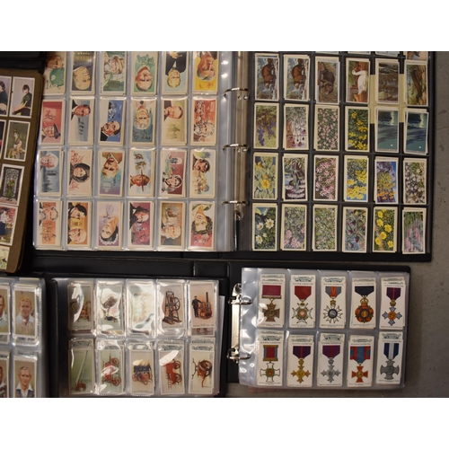 56 - A large collection of cigarette and trade cards, sets and part-sets, contained in loose-leaf albums ... 