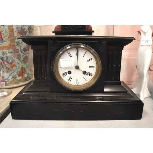 16 - Two black slate striking mantel clocks by Marti, 21cm high, and one other, (3).