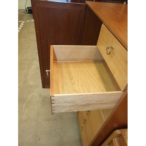 29 - A mid-20th-century-style craftsman-built tallboy, having a single panel door and seven drawers, 77cm... 