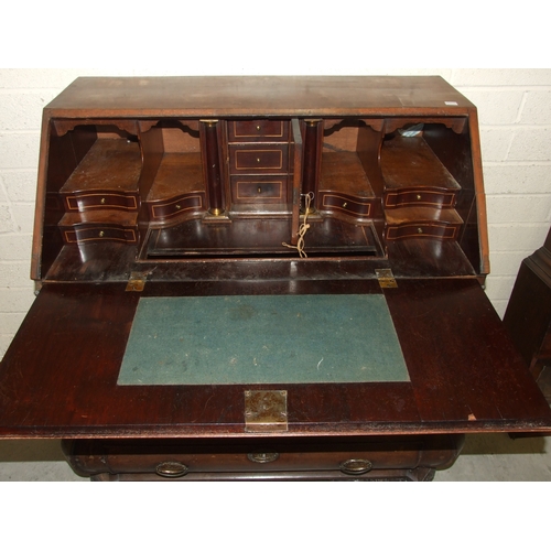 48 - An 18th century Continental mahogany bombe-shaped bureau, the fitted interior with concealed well, a... 