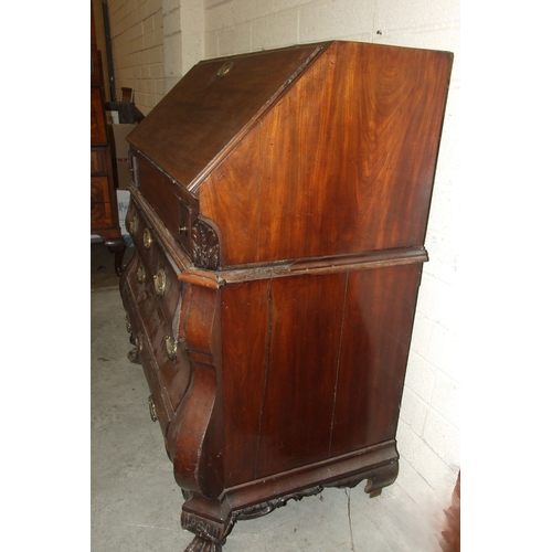 48 - An 18th century Continental mahogany bombe-shaped bureau, the fitted interior with concealed well, a... 