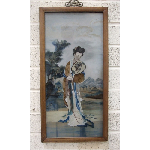 51 - An Oriental carved hardwood lamp stand, 175cm high and an Oriental watercolour of a female figure ho... 