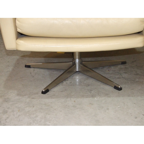 28 - A pair of 1960's/70's generously-seated and buttoned cream leather swivel chairs on five-legged chro... 