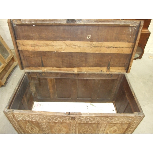 39 - An antique oak coffer, the front with four carved panels, 120 x 53cm, 73cm high, together with a pai... 