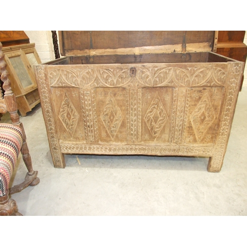 39 - An antique oak coffer, the front with four carved panels, 120 x 53cm, 73cm high, together with a pai... 