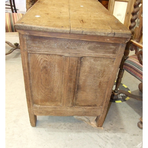 39 - An antique oak coffer, the front with four carved panels, 120 x 53cm, 73cm high, together with a pai... 