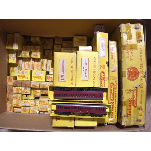 32 - Triang Railways, TT table-top gauge, two boxed train sets: TCX and T2, with a large quantity of coac... 