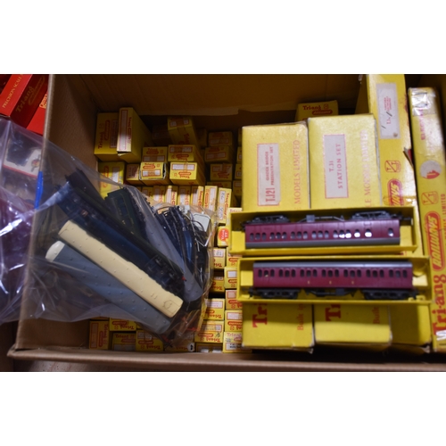 32 - Triang Railways, TT table-top gauge, two boxed train sets: TCX and T2, with a large quantity of coac... 