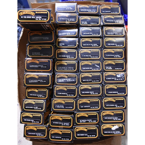 55 - Mainline, OO gauge, forty-three boxed wagons, (43).