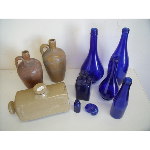 22 - Selection of various stoneware jars, hot water bottle and blue glassware including old bottles (in t... 