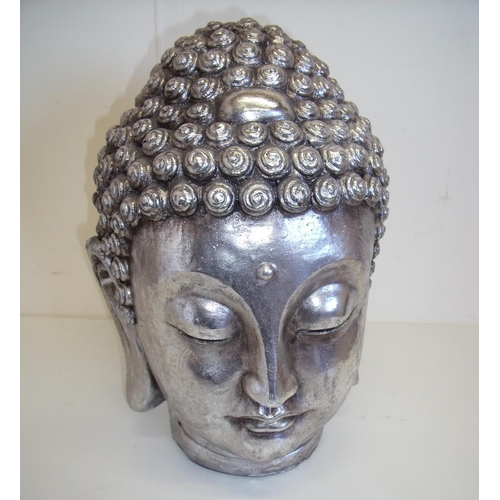 26 - Decorative figure of a Buddha's head in silver finish (35cm high)