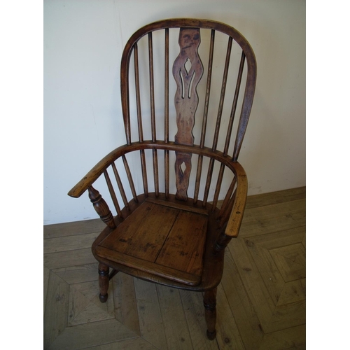 375 - Late 19th C elm Windsor stick back armchair with pierced central splat with H shaped under stretcher... 