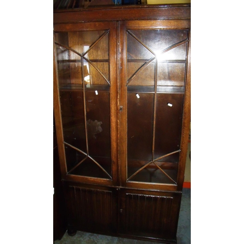 376 - 1930s oak cabinet with two upper glazed doors above two panelled cupboard doors on raised bun feet (... 