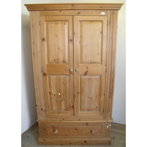377 - Moreland pine quality two door wardrobe with drawer to the base (width 107cm)