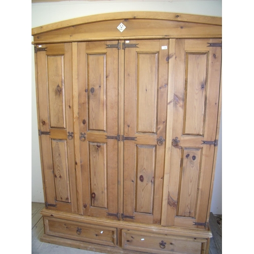 380 - Modern pine four door wardrobe with two drawers to the base (width 160cm)