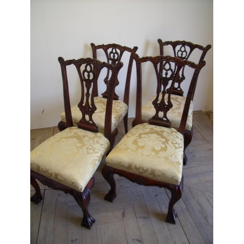 387 - Set of four quality reproduction Chippendale style mahogany dining chairs with upholstered seats on ... 