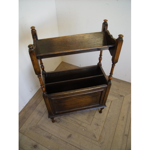 389 - Oak combination book trough and magazine stand on turned supports with carved and panelled detail (4... 