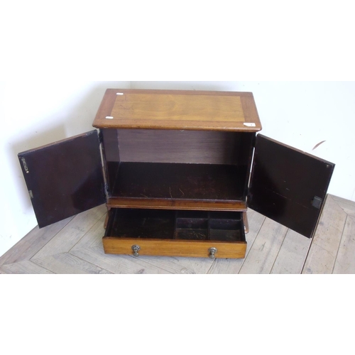 4 - Early - mid 20th C table cabinet with two panelled cupboard doors above singe drawer on stepped base... 