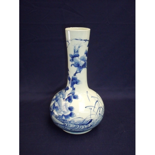 12 - Japanese blue & white bottleneck vase with nine digit signature panel to the base (28.5cm high)