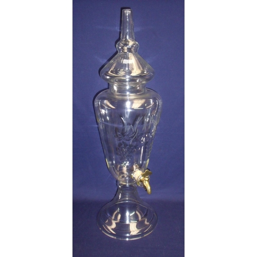 22 - Large clear and cut glass wine dispenser with grape vine detail on raised turned base with detachabl... 