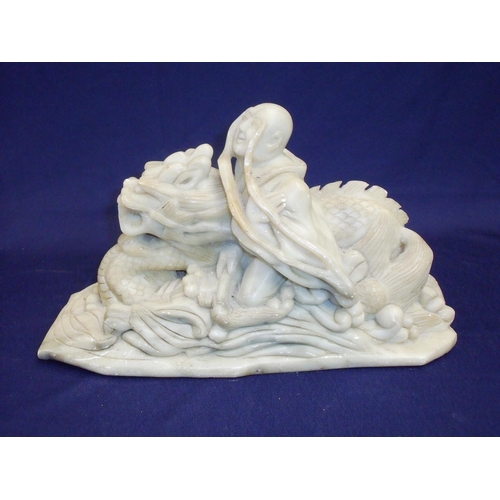 33 - Large Chinese soapstone carving depicting figure of a Sage riding the back of a dragon on the waves ... 
