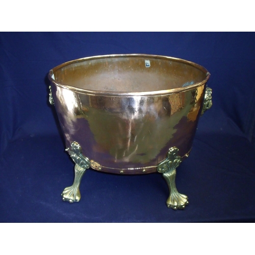 37 - 19th C copper jardinière of over form with lion mask handles and four raised paw feet (42cm x 34cm x... 