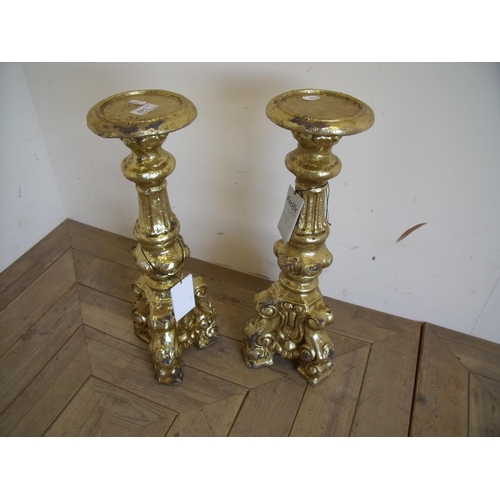 57 - Pair of as new ex-shop display gilt candle stands (52cm high)